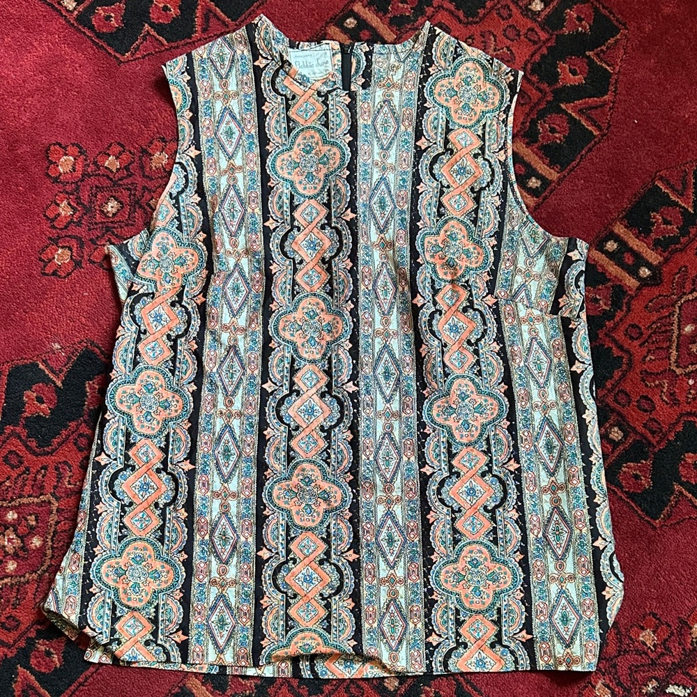 Bobby June of Kansas City sparkle and neon patterned top